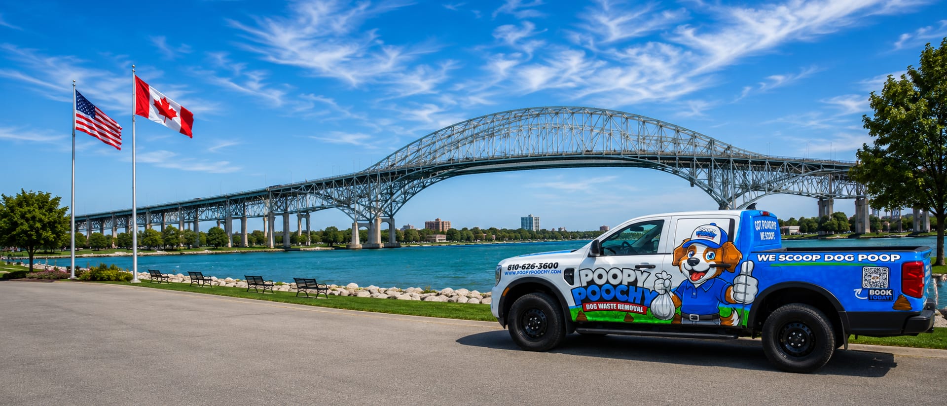 Poopy Poochy service truck against the Blue Water Bridge — dog waste removal in St. Clair County